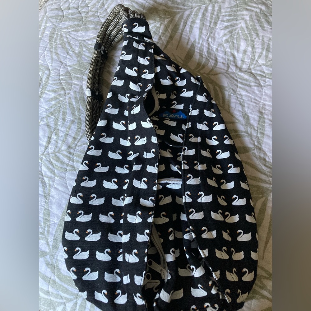 Like new. Used only once.  Sporty Crossbody black with ducks or swans.